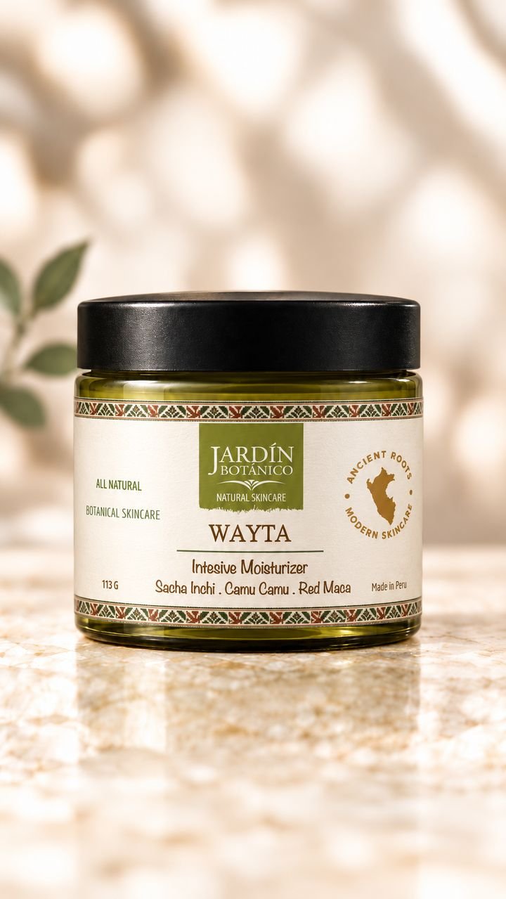 Wayta Intensive Moisturizer by Jardín Botánico: amber-green glass jar with a black lid and a cream label with an Andean woven border, on a marble surface